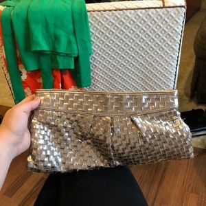 Gold woven clutch.